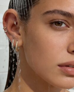 ultra professional lifestyle medical product photography showing proper ear rinsing after piercing k0r0hiw7sq158w757a74 0