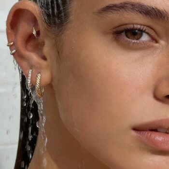 ultra professional lifestyle medical product photography showing proper ear rinsing after piercing k0r0hiw7sq158w757a74 0